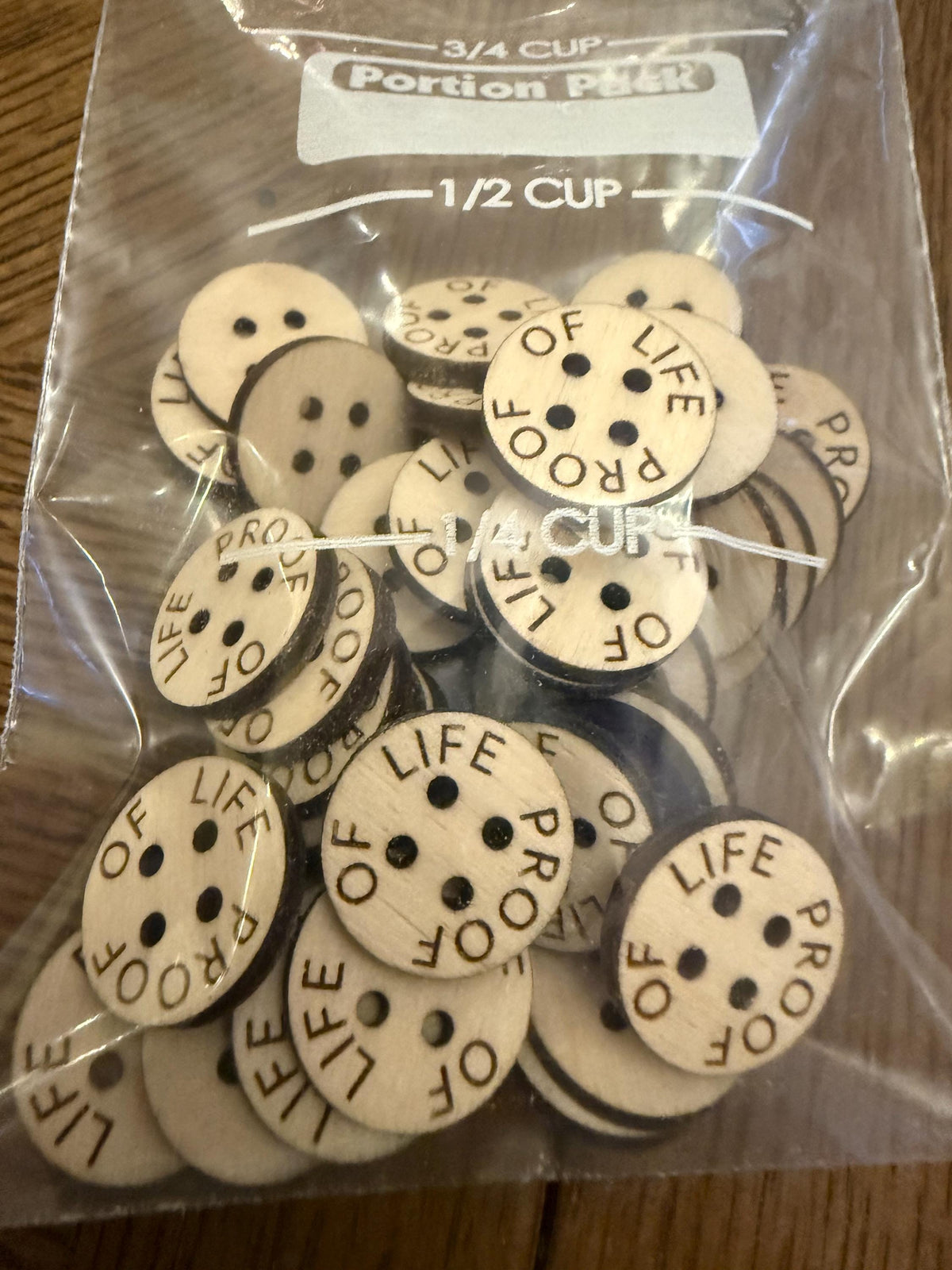 Custom wood buttons with laser engraved text available in assorted quantities