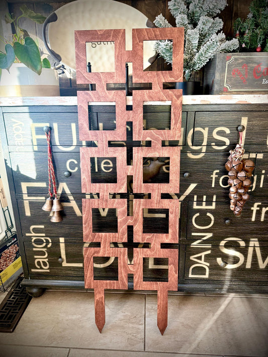 Gunstock Colossal Square Shapes indoor plant trellis displayed upright against a rustic painted wood cabinet