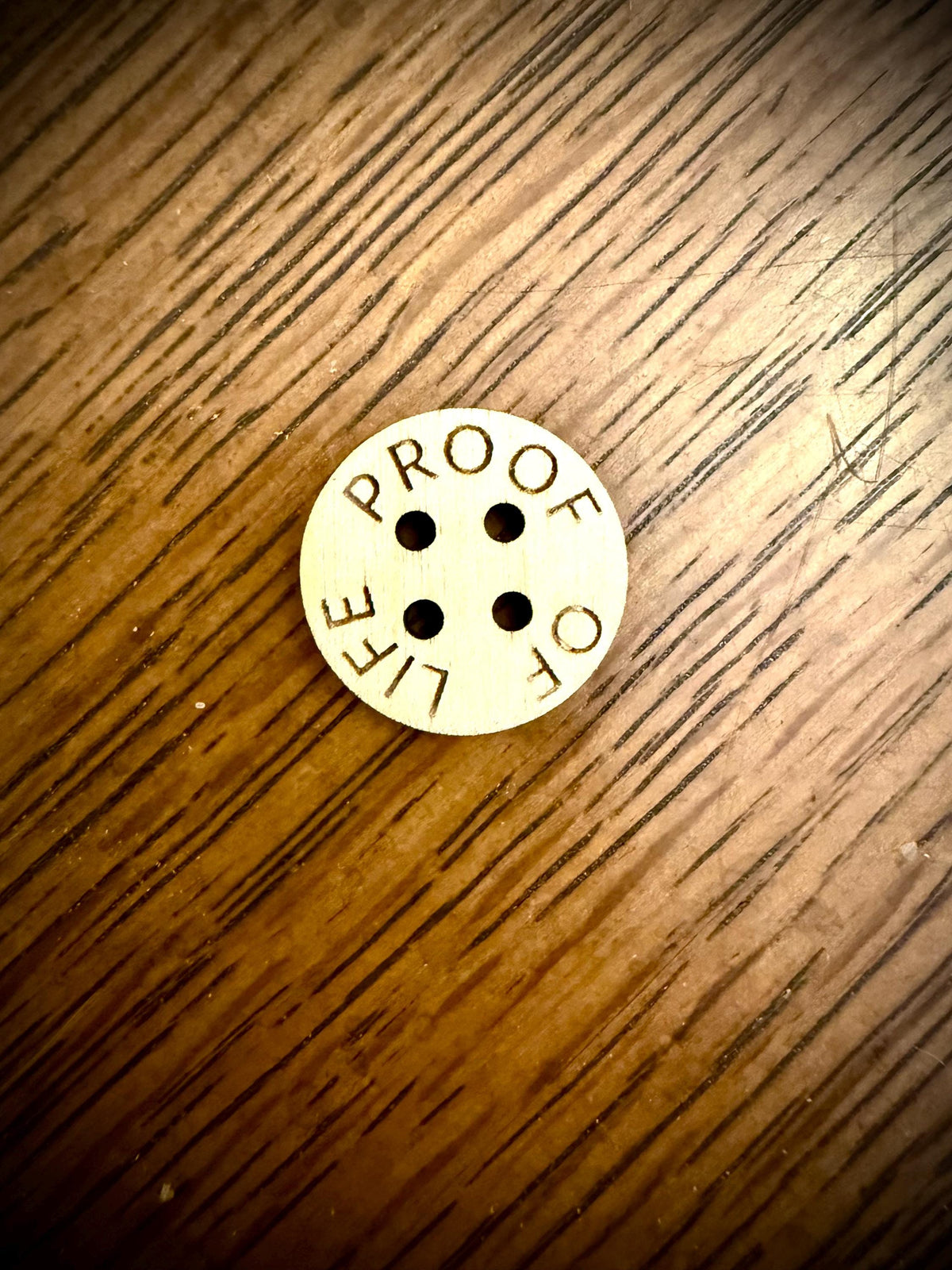 Custom wood buttons with laser engraved text available in assorted quantities