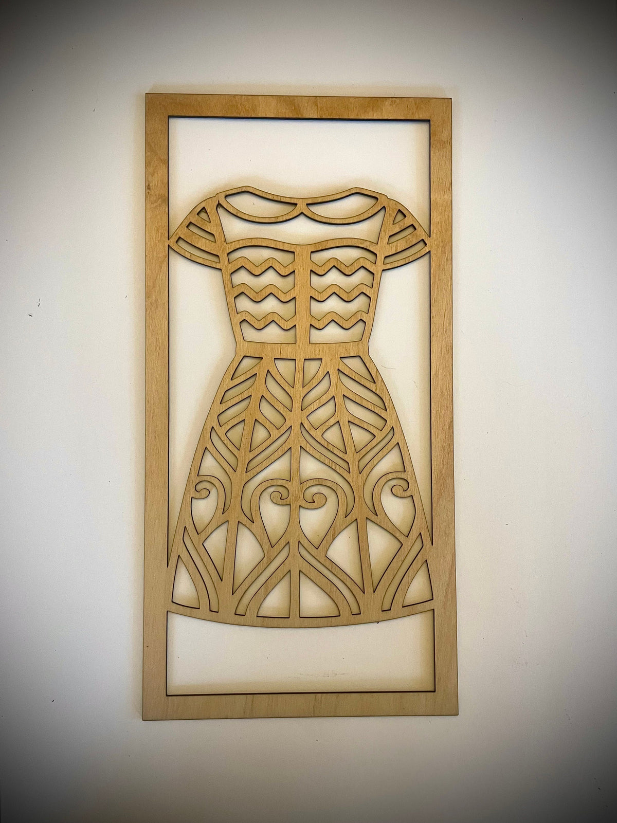 Left panel of the Boho Fashion Sundress Mandala wood wall art, chevron bodice and leaf-pattern skirt, Natural Stain